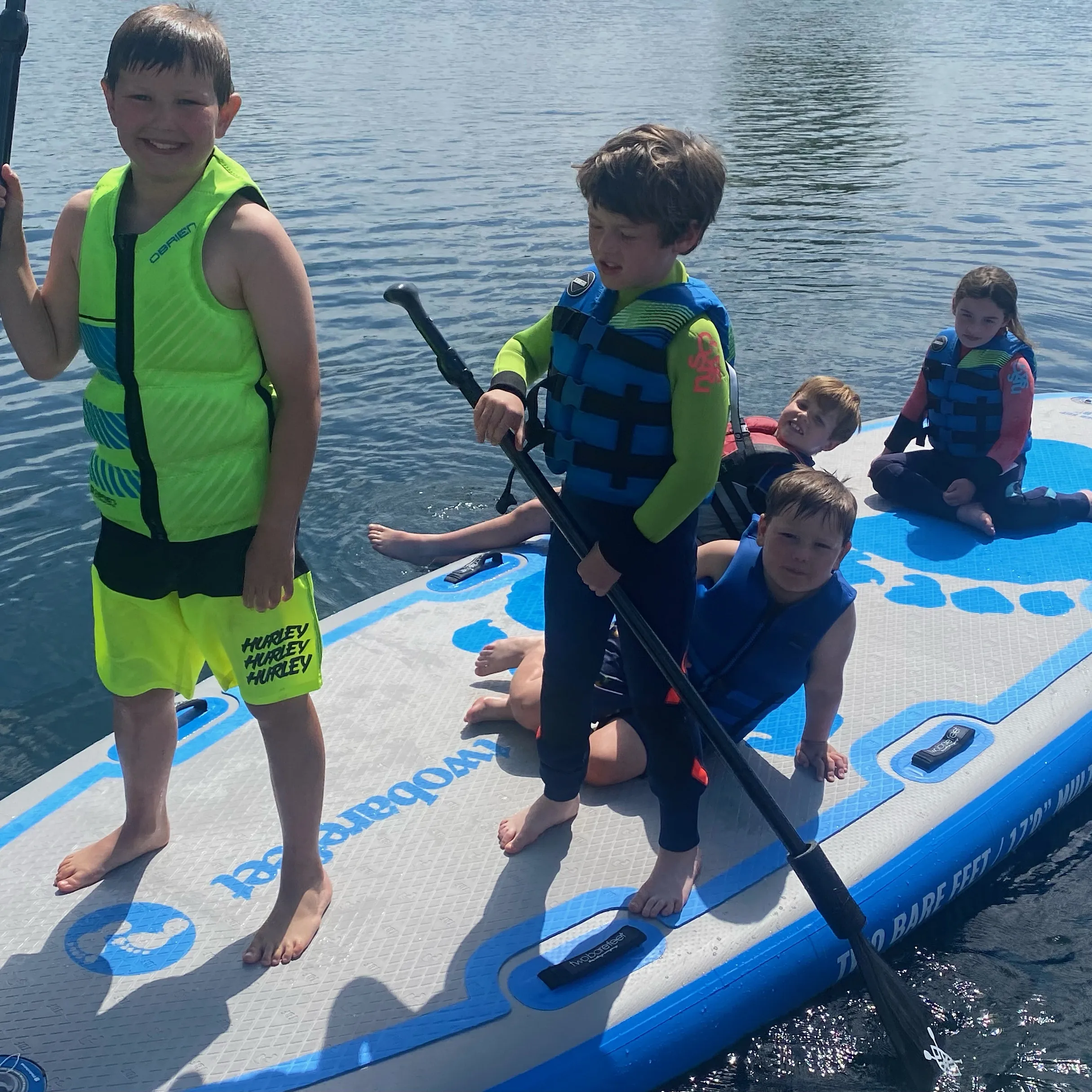 Family paddle boarding on the cotswolds lakes