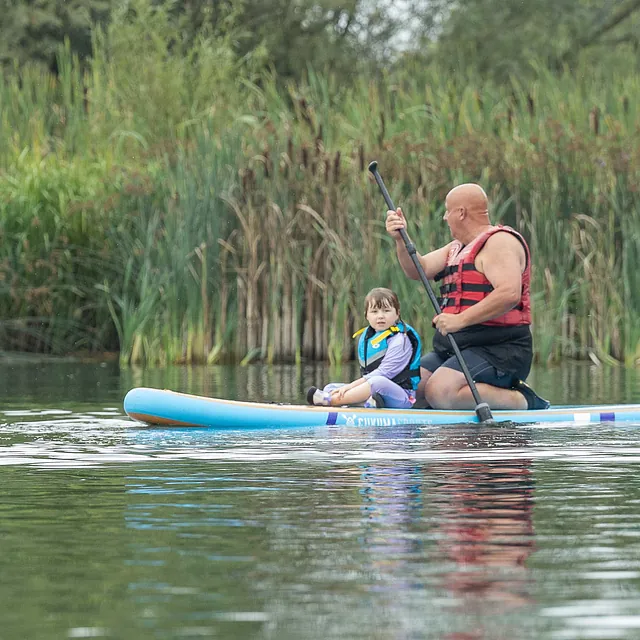 Family paddleboarding on the cotswold lakes