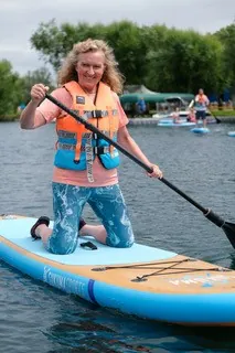 kneeling on paddleboard