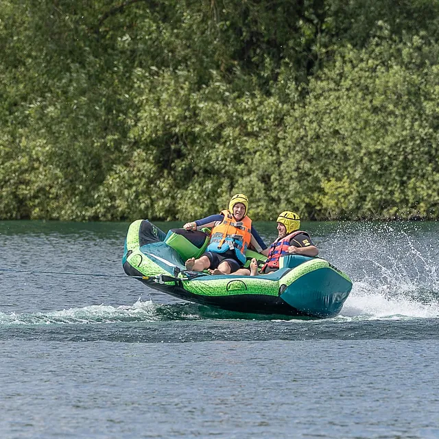 Enjoying inflatable rides on the Cotswold water park