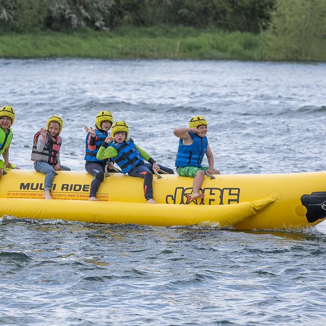 children having fun on an inflatable ride